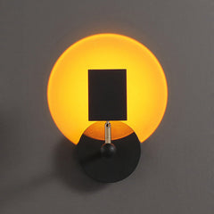 Sunset wall light casting a warm circular glow